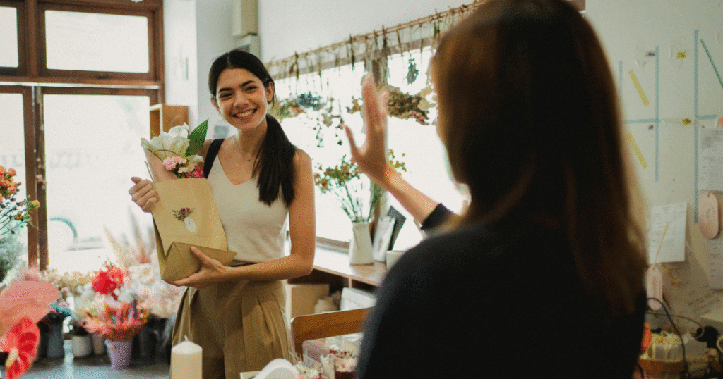 Customer receiving a beautiful bouquet at a florist shop , offering the best flower delivery and same-day services in Muar.